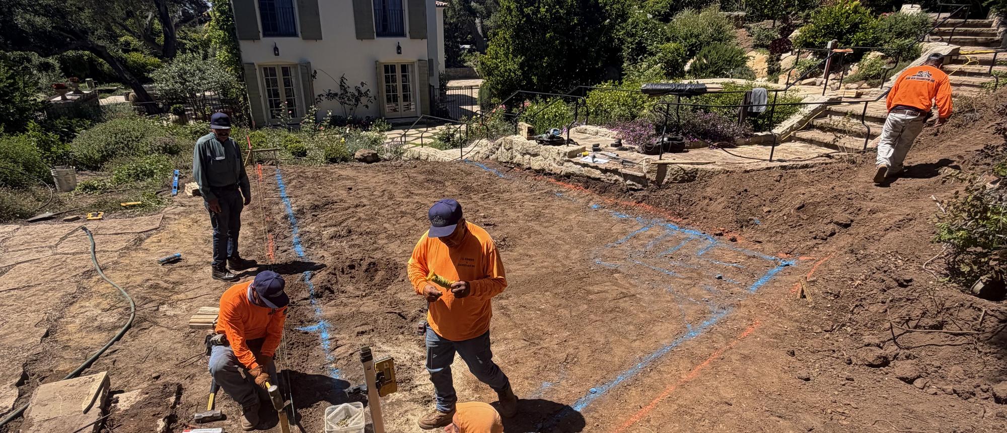 Crew setting out a pool on site