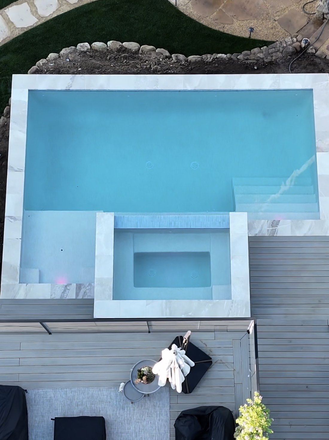 Pool with spillover spa and composite deck, seen from above