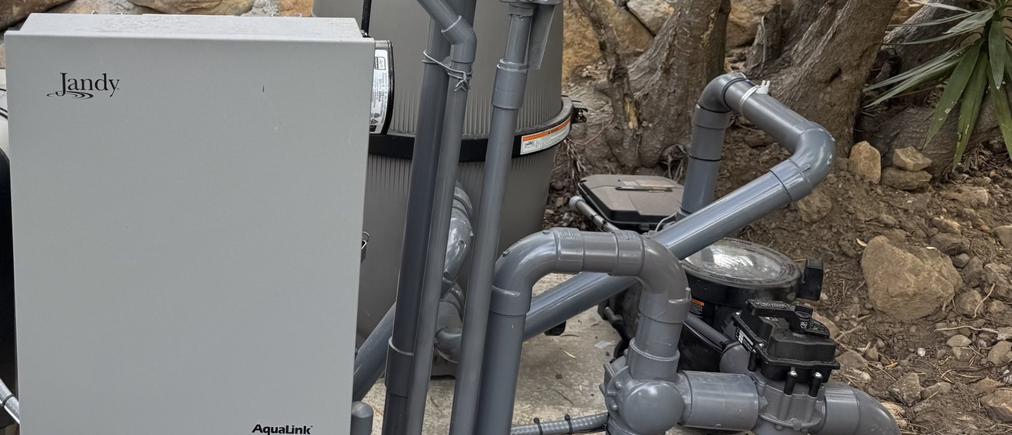 New equipment pad with a Jandy AquaLink automation panel, cartridge filter, pump and valves
